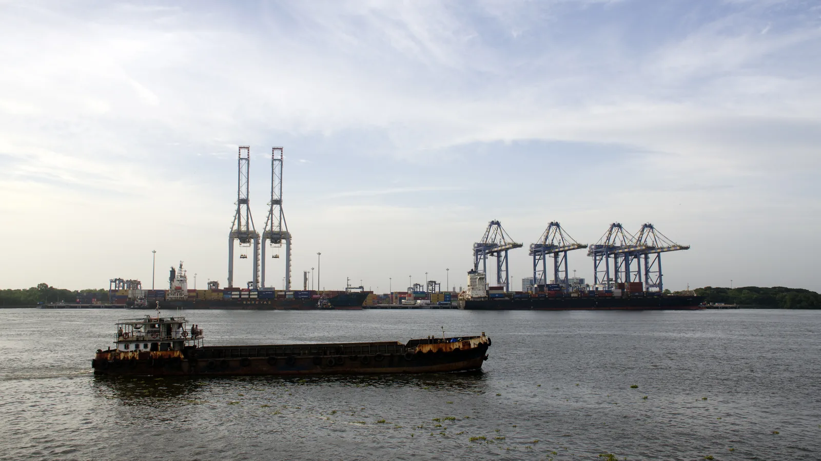 A small tanker passes the container terminal at Vallarpadam, Cochin Port.